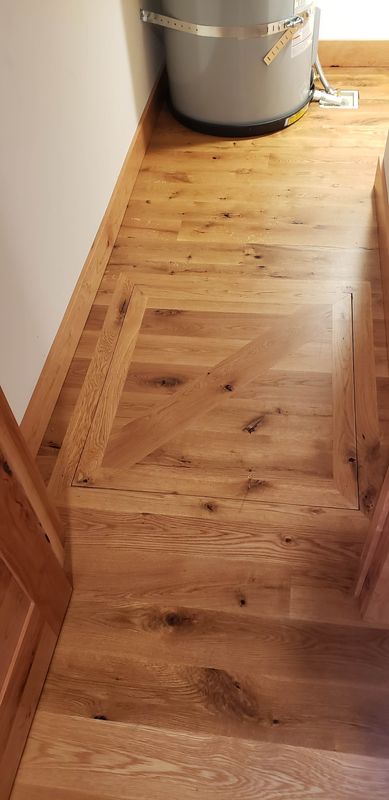 Custom oak trapdoor inlay with diagonal border detail