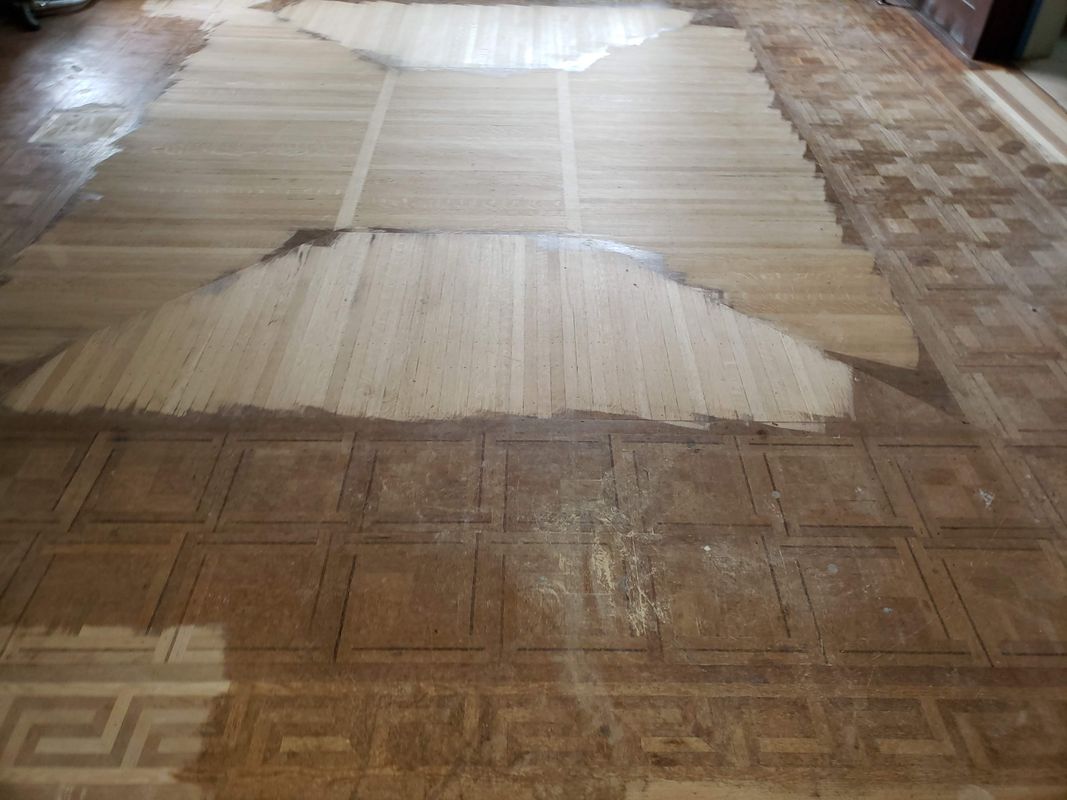 Hardwood floor after full old finish removal, ready for refinishing