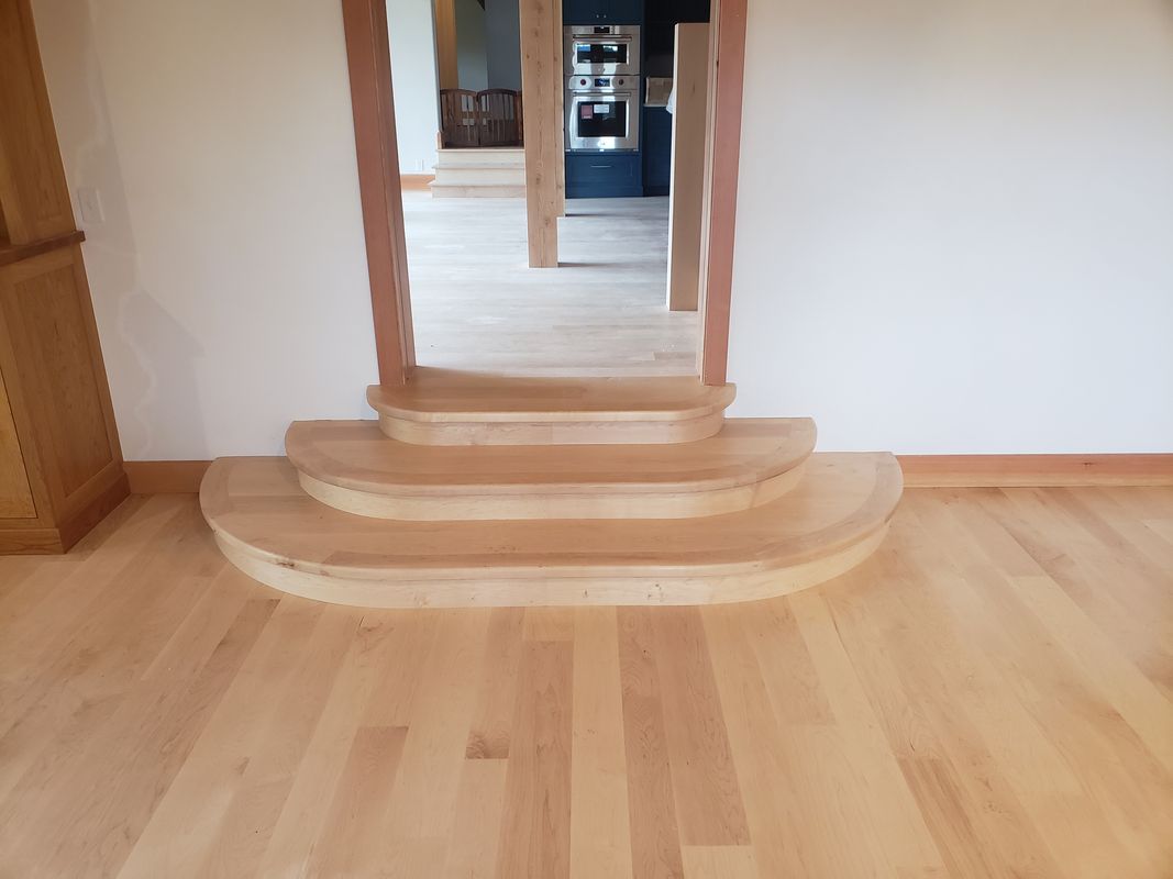 Refinished hardwood stairs with rounded nosing detail